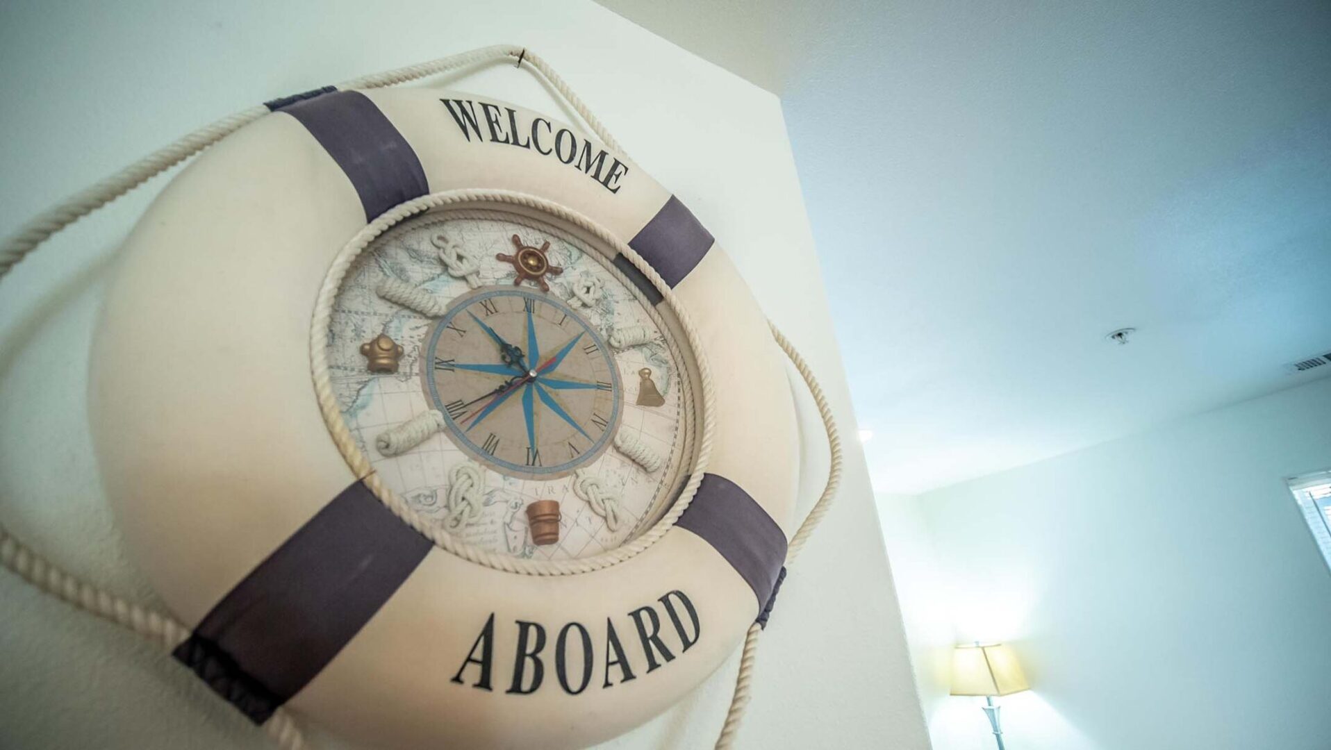 A white life preserver with the words " welcome aboard ".